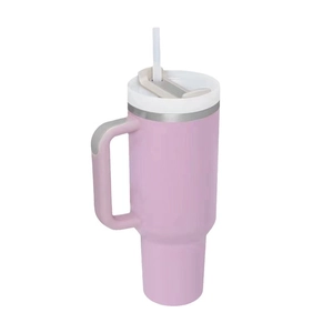 Pink 40oz stainless steel insulated tumbler with handle and straw on white background