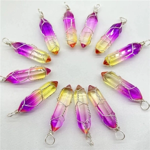 Detailed view of wire-wrapped hexagonal crystal pendants in various vibrant colors