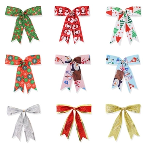 Nine diverse Christmas ribbon bows featuring festive prints and glitter textures for tree decor