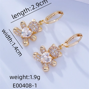 Detail view of gold bear earrings with dimensions showing 2.9cm length and pavé crystals