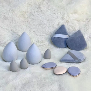 12-piece makeup sponge set with teardrop blenders and powder puffs on soft faux fur