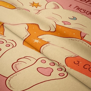 Close-up of the soft fabric texture and vintage cat print on the decorative wall tapestry