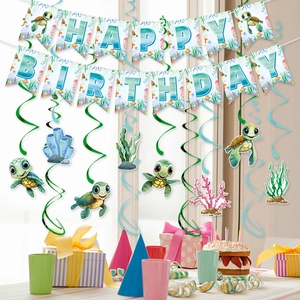 Sea turtle themed birthday party decorations with banner and hanging swirl ornaments