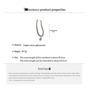 Detail showing pearl necklace dimensions with 39.5cm chain and 10.5cm extension