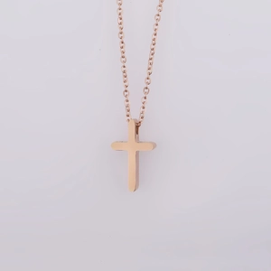 Polished rose gold stainless steel cross necklace with a minimalist mirror finish