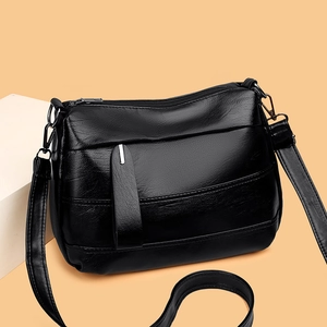 Sac bandoulière en cuir souple noir avec bandoulière réglable et compartiments