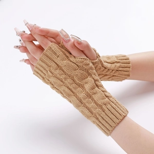 Detail of camel cable knit fingerless arm warmers showing thick braided texture and elastic cuffs