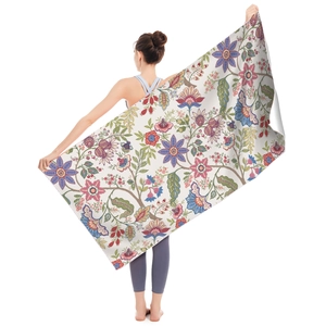 Detail of microfiber beach towel showing bohemian floral pattern and large size dimensions