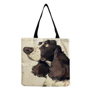 Close-up of the canvas tote bag featuring an artistic brown and white hound dog illustration