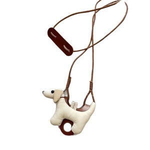 Minimalist beige leather puppy bag charm with brown ears and hand-stitched detailing