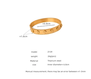 Detail of 1.0cm wide gold-plated titanium steel bangle with floral relief patterns