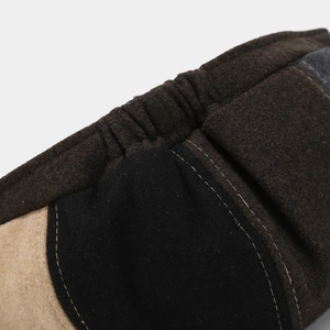 Detailed macro view of stitched multicolor wool fabric and elastic seam on beret