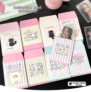 Macro shot of cute macaron-colored card envelopes with cat and dog patterns for kpop cards