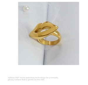 Macro view of 18K gold plated lip ring showcasing 360-degree mirror polished surface