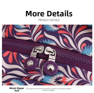 Detail of smooth metal zippers on floral oxford fabric backpack with purple leaf prints