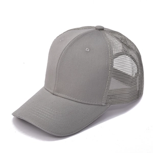 Detail of light gray mesh trucker hat with breathable fabric and curved brim