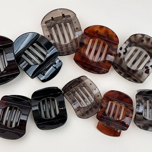 Set of 10 tortoise shell and solid color rectangle hair claws on white background