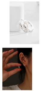 Detailed view and model shot of S925 sterling silver star earrings with pavé zircon