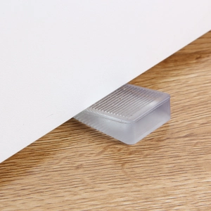 Transparent non-slip wedge furniture leveler for cabinets and doors on wooden floors