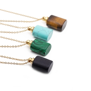 Detail of four semi-precious stone perfume bottle pendants on gold-plated chains