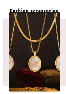 Detail of vintage oval shell pendant with zircon in 18k gold plated finish