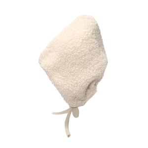Detailed texture of warm cream plush lamb wool earflap hat with tie-up straps