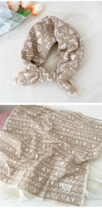 Detail of khaki cotton linen square scarf featuring white geometric patterns and lace edges