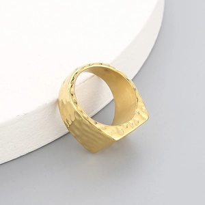 Industrial style wide golden square ring with textured hammered finish on stone base