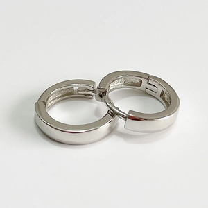 Polished 925 sterling silver huggie hoop earrings for women on white background