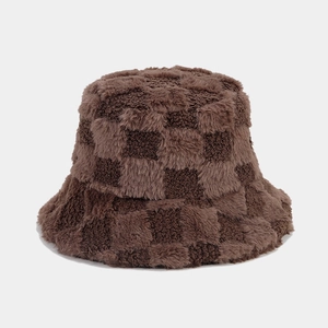 Close-up of brown checkerboard faux fur bucket hat showing soft plush texture and pattern