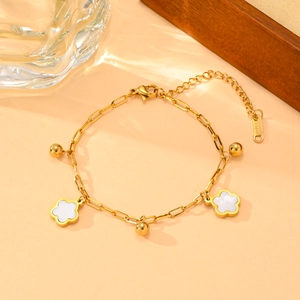 Gold stainless steel bracelet with white five-petal flowers and polished gold beads