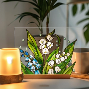 Detail of 3D floral acrylic ornament with lily of the valley and a wooden base