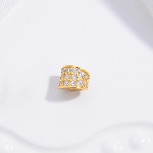 Macro view of gold-plated S925 silver spacer bead with sparkling cubic zirconia inlay
