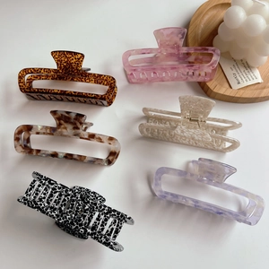 Set of six large hollow acetate hair claws in leopard, tortoiseshell, and marble patterns