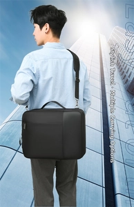 Close-up of a black multifunctional laptop bag for business travel with shoulder strap