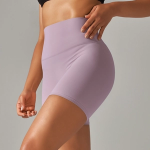 Detail view of high-waist lavender yoga shorts featuring seamless tummy control design