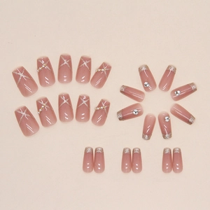 Short ballet pink press-on nails with silver glitter, pearls, and sparkling diamonds