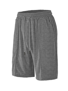 Detail of dark gray jacquard sports shorts with drawstring elastic waist and side pockets
