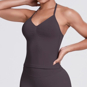 Detail of dark purple seamless ribbed yoga tank top featuring a pleated V-neckline design