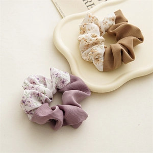 Detail of floral chiffon scrunchies set featuring pleated patchwork design and soft texture