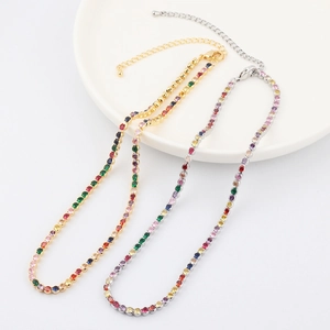 Detailed macro view of colorful zircon tennis chains with gold and silver metal bases