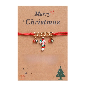 Handmade red braided Christmas wish bracelet with gold chain and enamel candy cane charm