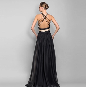 Detail of cross back straps and champagne gold waist panel on a black chiffon gown