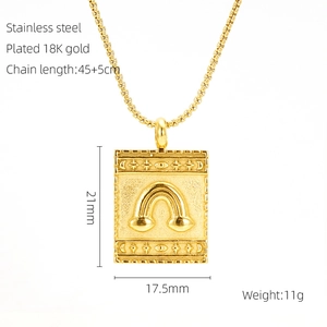 Detail view of 18K gold plated stainless steel square pendant with star and moon relief