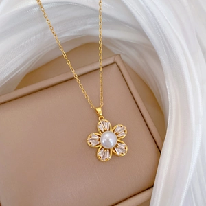 Detail of titanium steel necklace with five-petal flower zircon and white pearl decoration