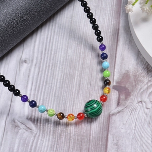 Detailed view of yoga 7 chakra beaded necklace with natural tiger eye and crystal stones