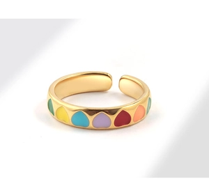 Detailed close-up of adjustable gold-plated ring with colorful enamel heart patterns
