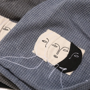 Modern waffle knit beanie with abstract art patch, autumn slouchy style for women