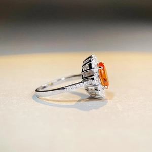 Exquisite S925 sterling silver ring with oval orange gemstone and halo diamond accents