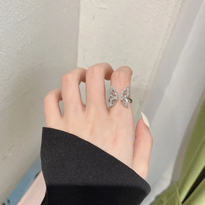 Elegant bow-shaped open ring featuring silver butterfly wings and sparkling cubic zirconia